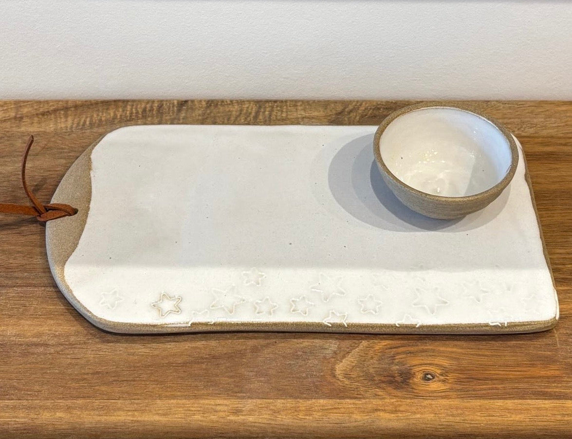 White ceramic tray with a brown bowl on a wooden surface